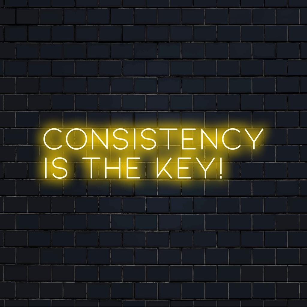 Custom made LED neon sign displaying 'Consistency Is The Key!', ideal for inspirational wall decor indoors. Non-specific design type.