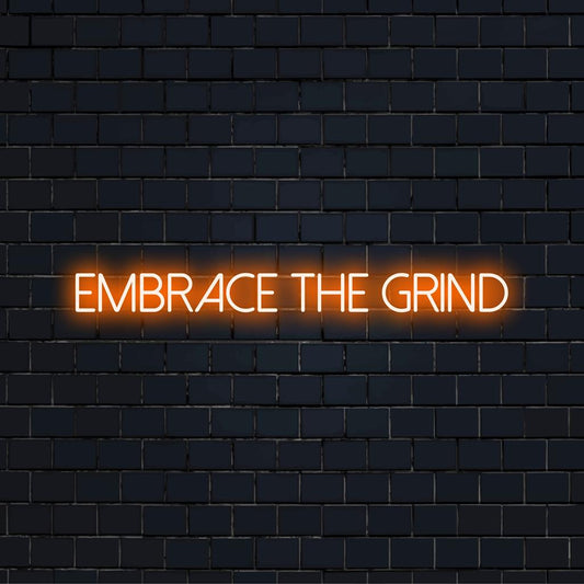 Custom-made Embrace The Grind LED neon sign featuring an inspiring quote, perfect for motivational decor.