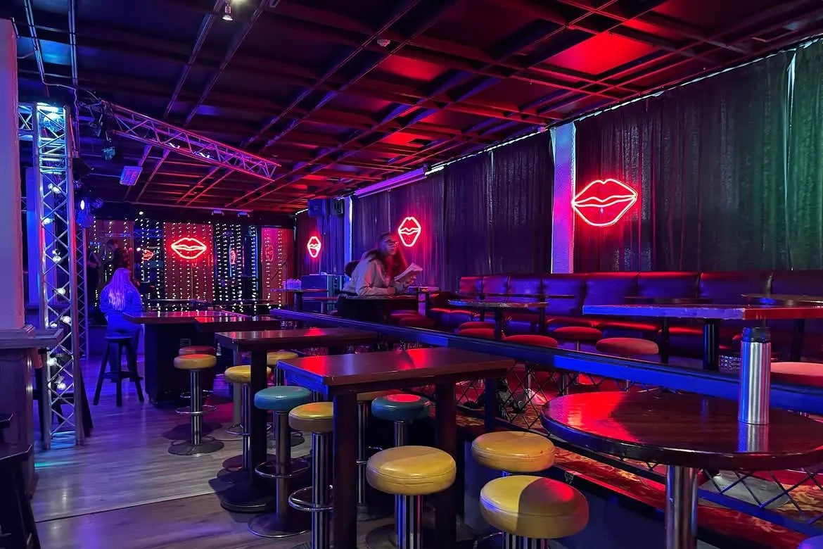 Red lip-shaped LED neon signs used on a Solar Films production set
