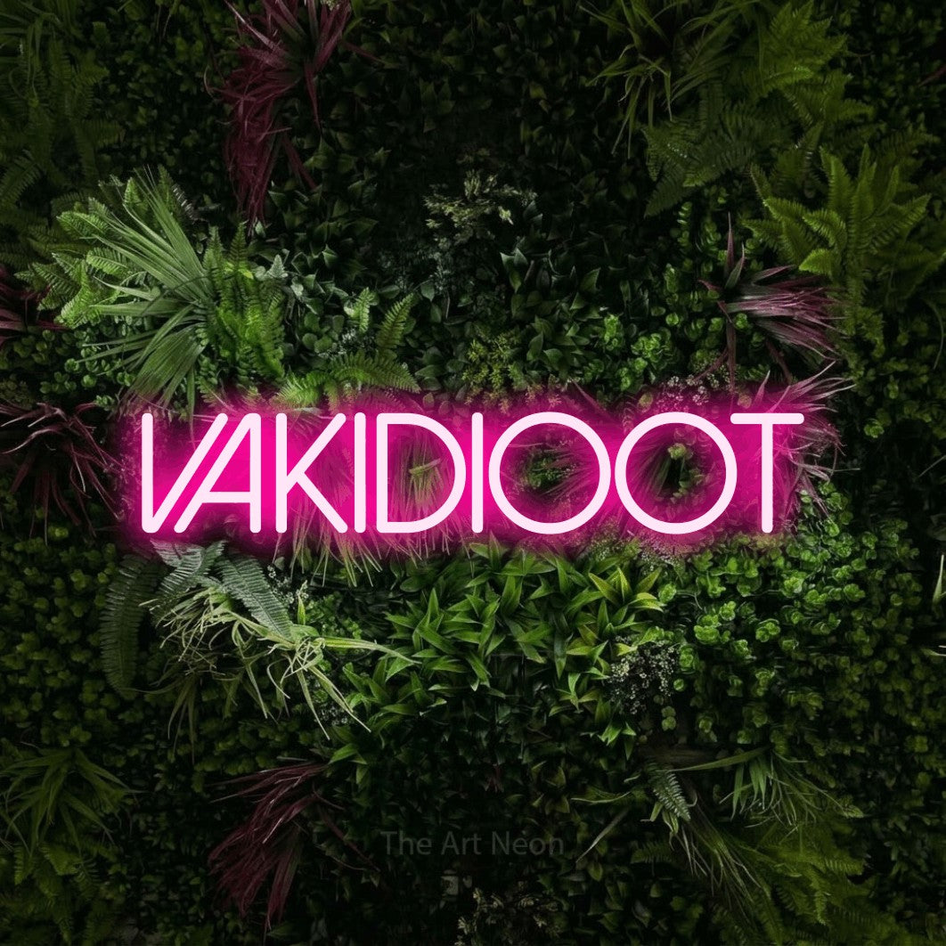 LED neon sign reading “vakidioot”, arranged in a single line.