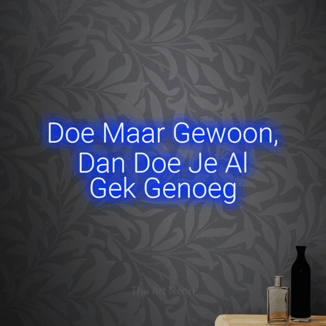 LED neon sign reading “Doe Maar Gewoon, Dan Doe Je Al Gek Genoeg”, arranged in 3 lines.