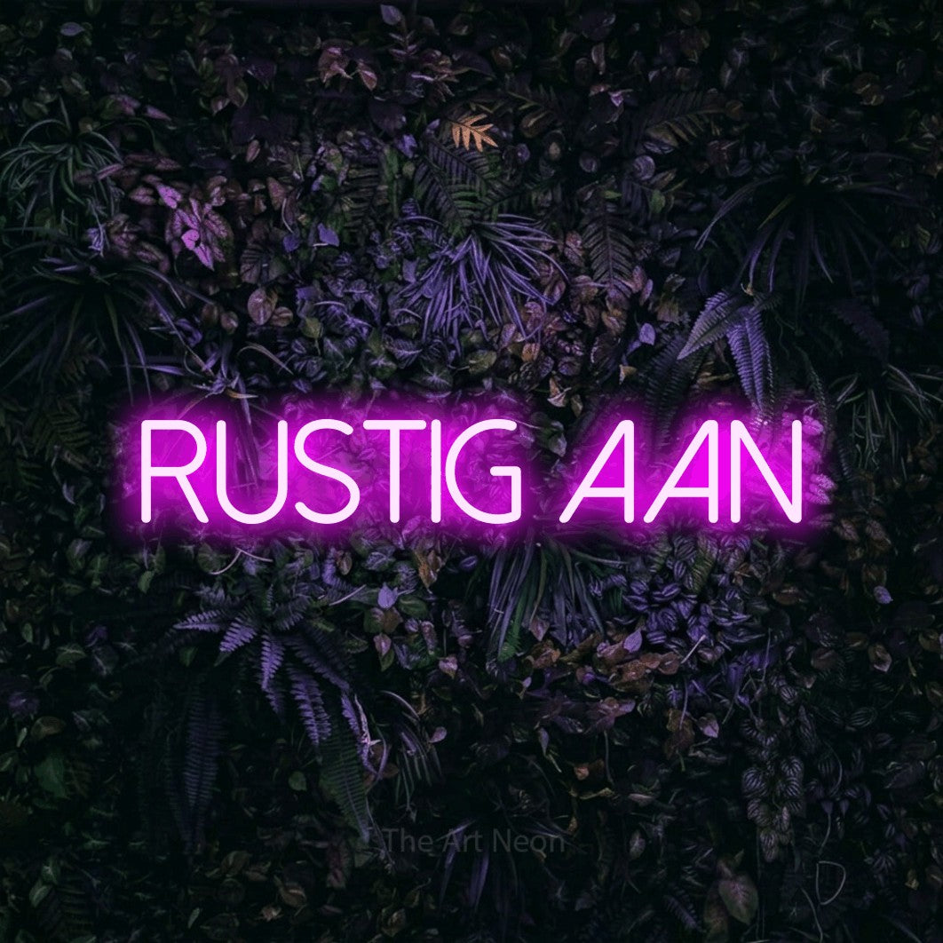LED neon sign reading “RUSTIG AAN”, arranged in a single line.