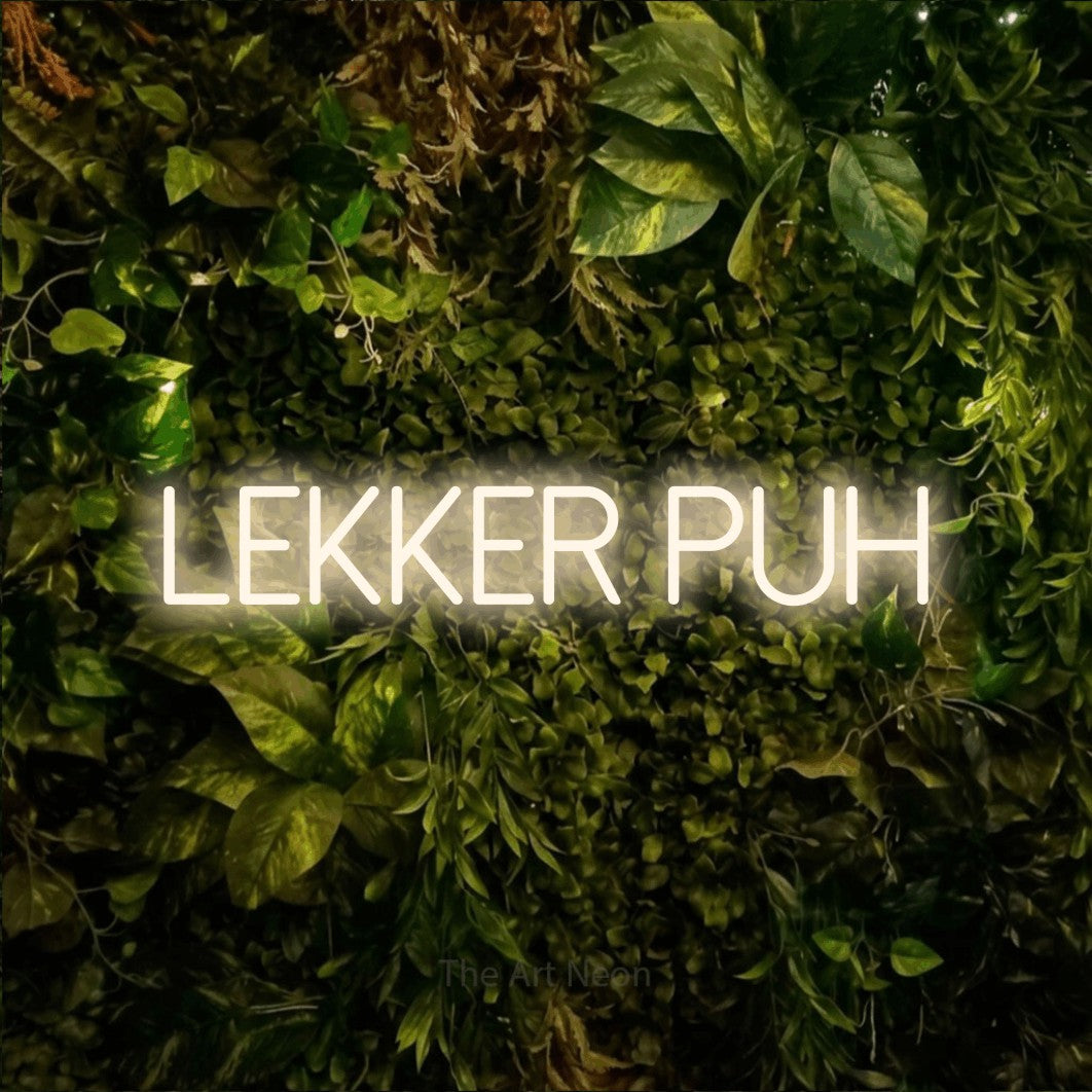 LED neon sign reading “Lekker puh”, arranged in a single line.