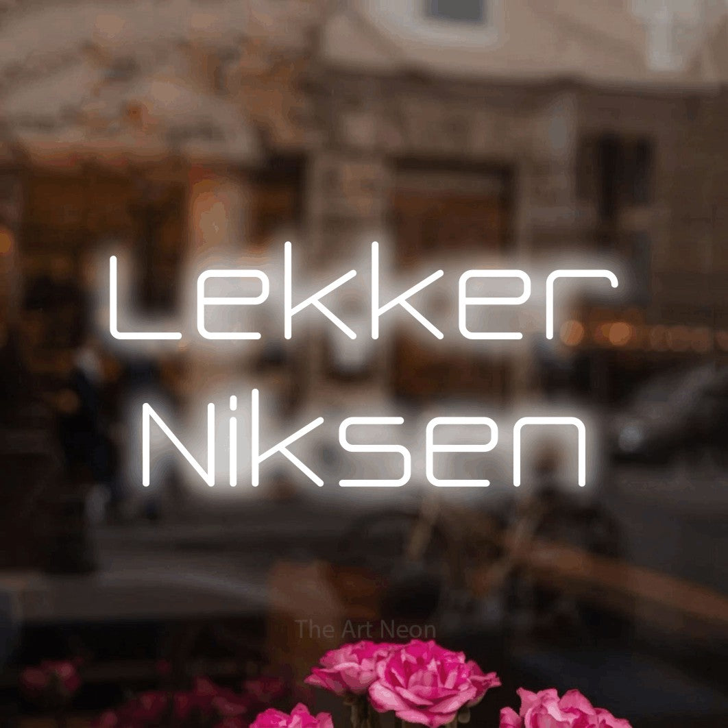 LED neon sign reading “Lekker Niksen”, arranged in 2 lines.