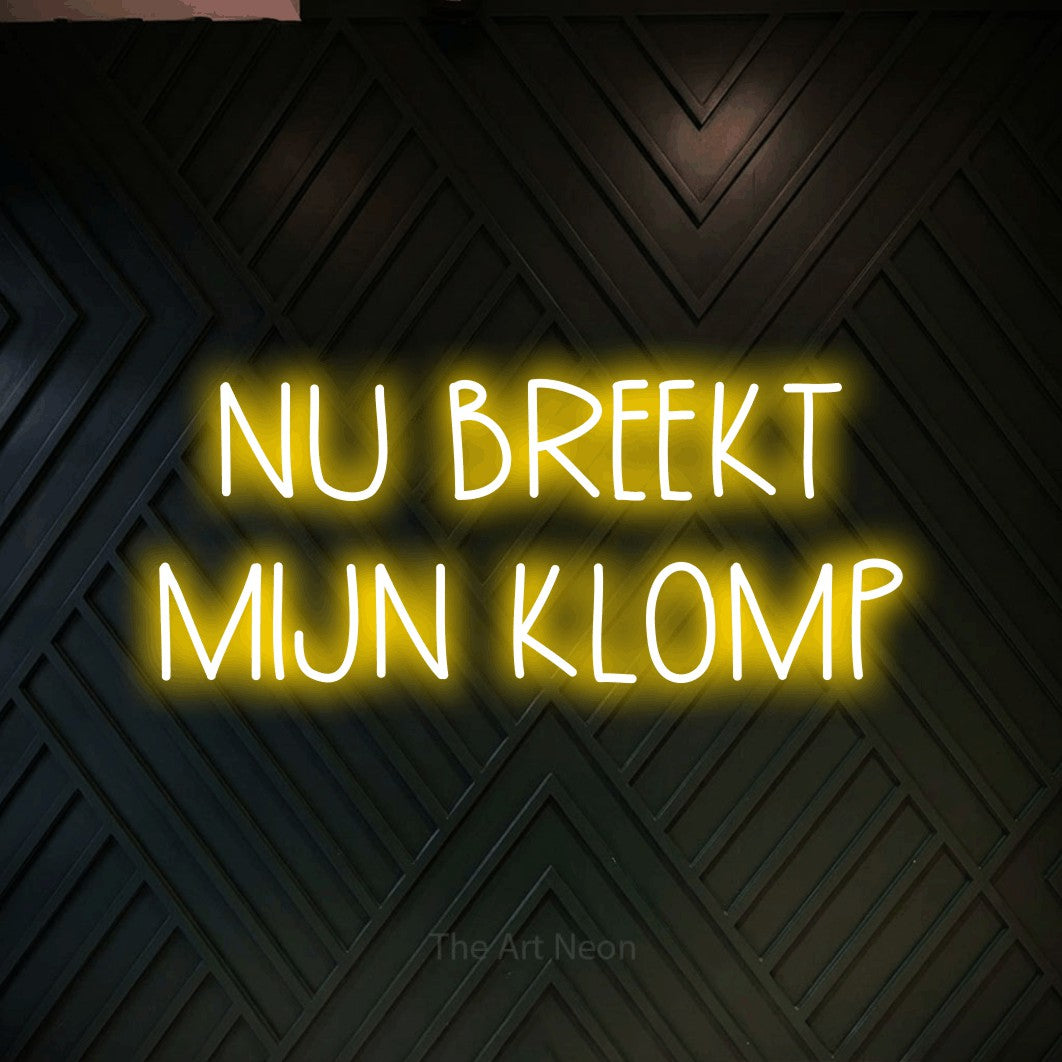 LED neon sign reading “NU BREEKT MIJN KLOMP”, arranged in 2 lines.
