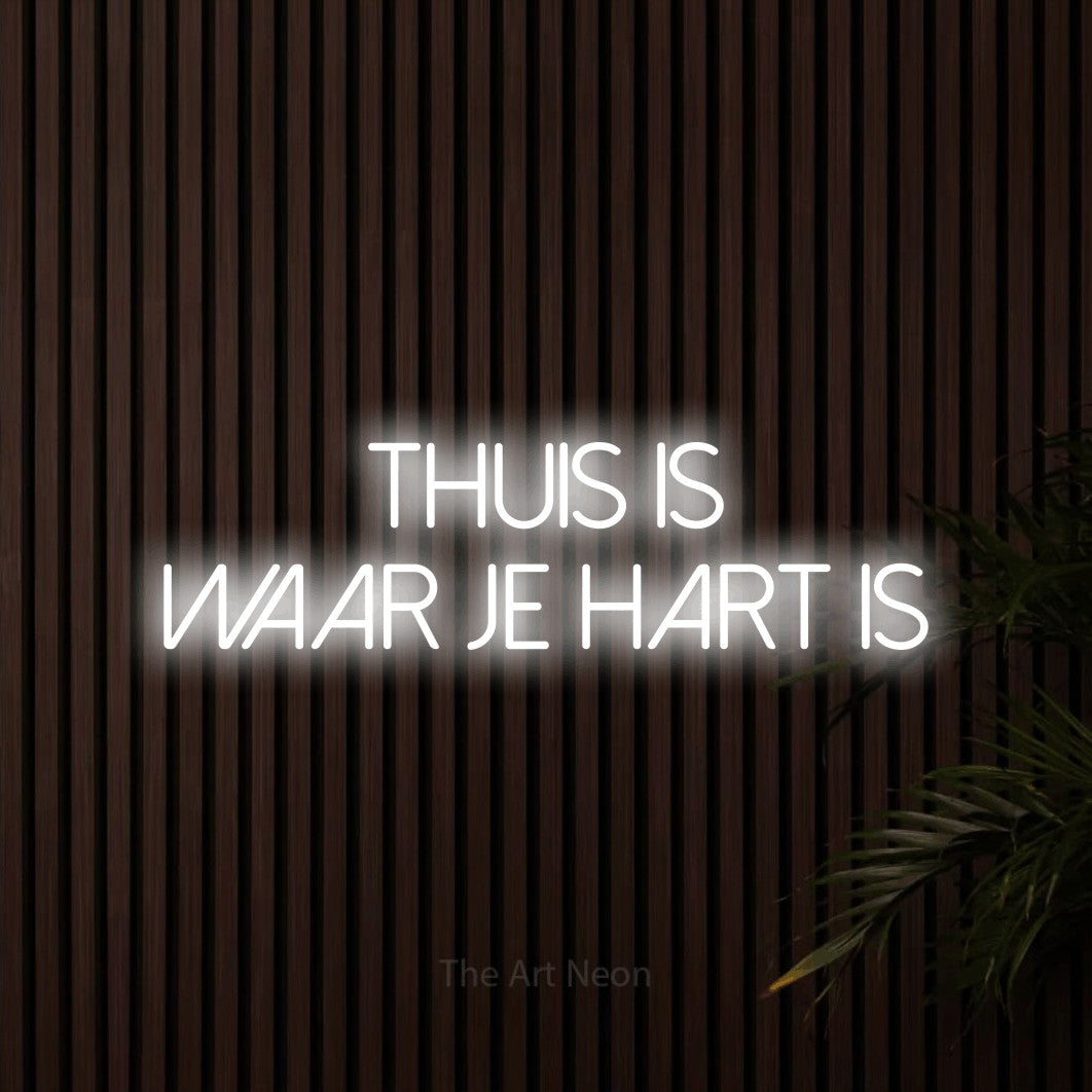 LED neon sign reading “THUIS IS WAAR JE HART IS”, arranged in 2 lines.