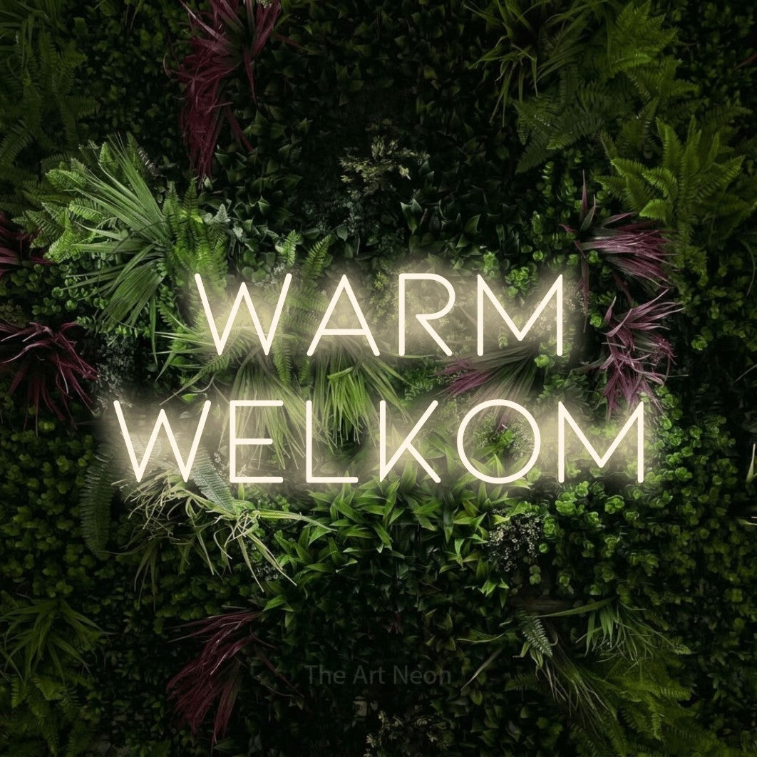 LED neon sign reading “warm welkom”, arranged in 2 lines.