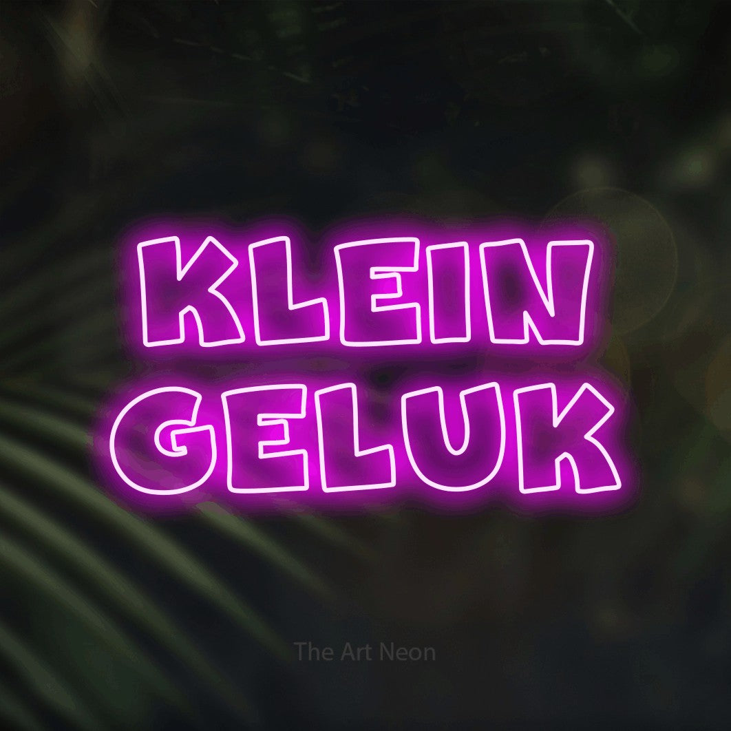 LED neon sign reading “Klein Geluk”, arranged in 2 lines.