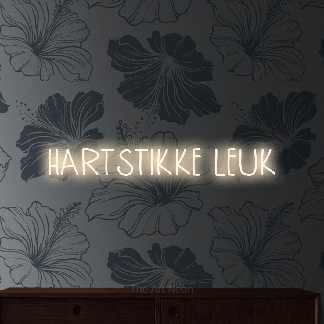 LED neon sign reading “HARTSTIKKE LEUK”, arranged in a single line.