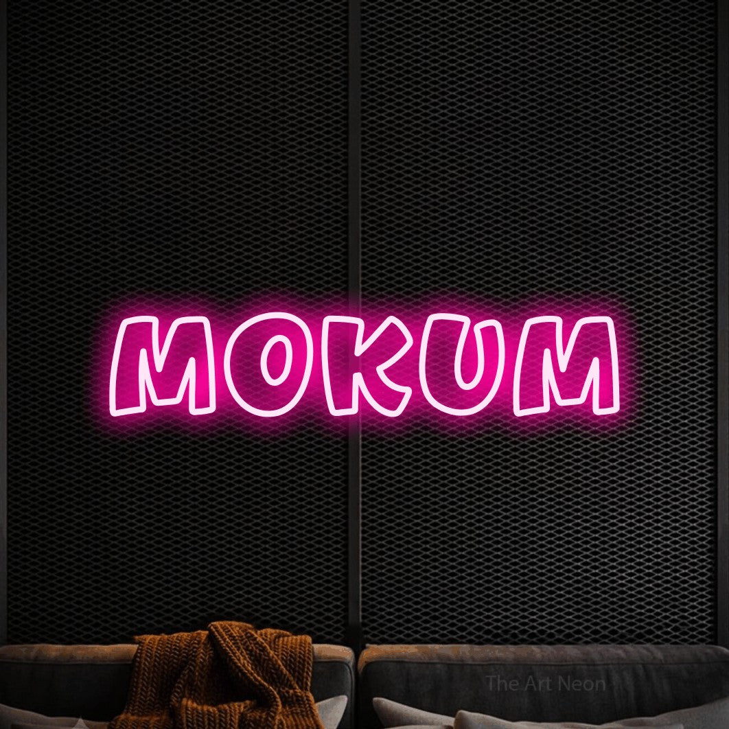 LED neon sign reading “Mokum”, arranged in a single line.
