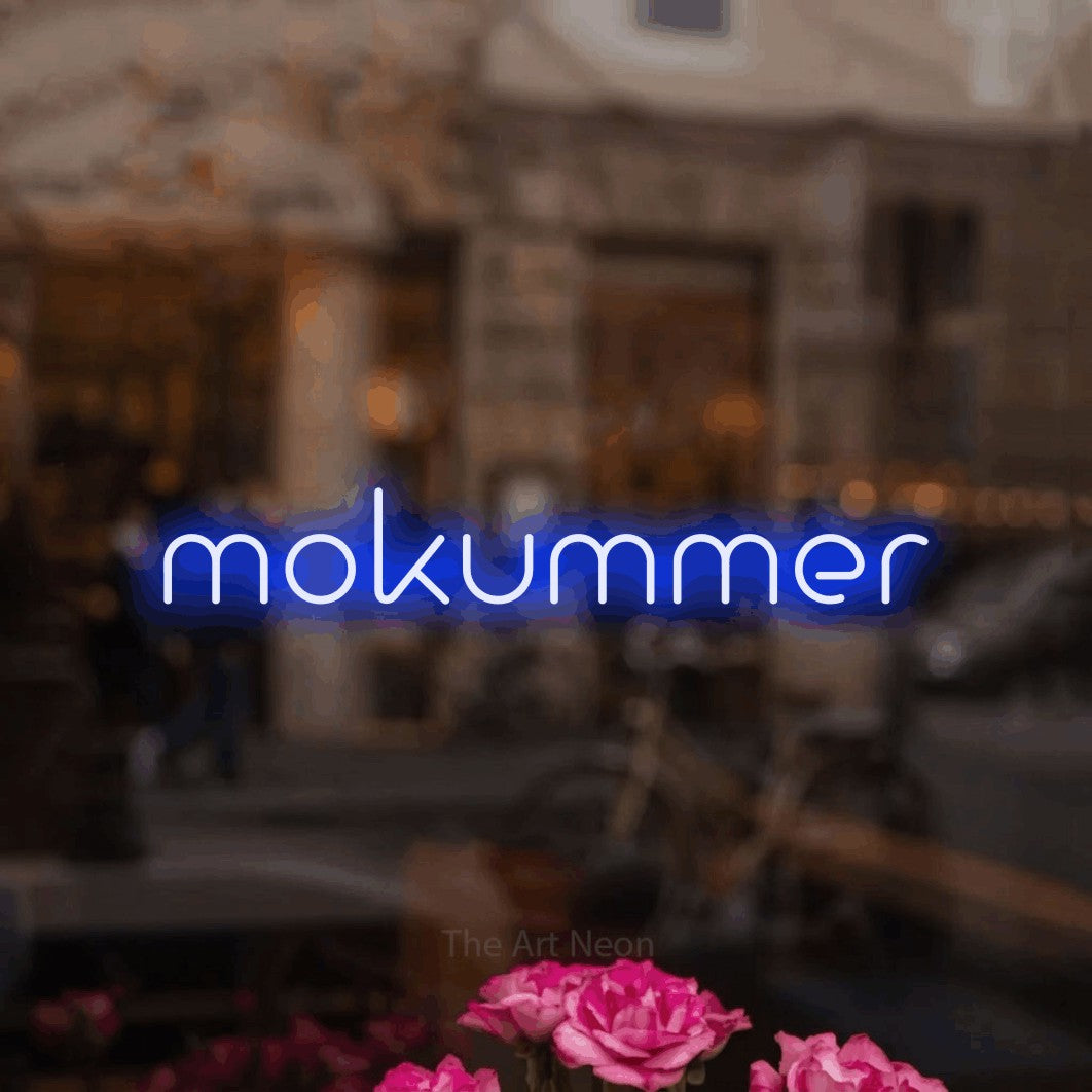 LED neon sign reading “mokummer”, arranged in a single line.