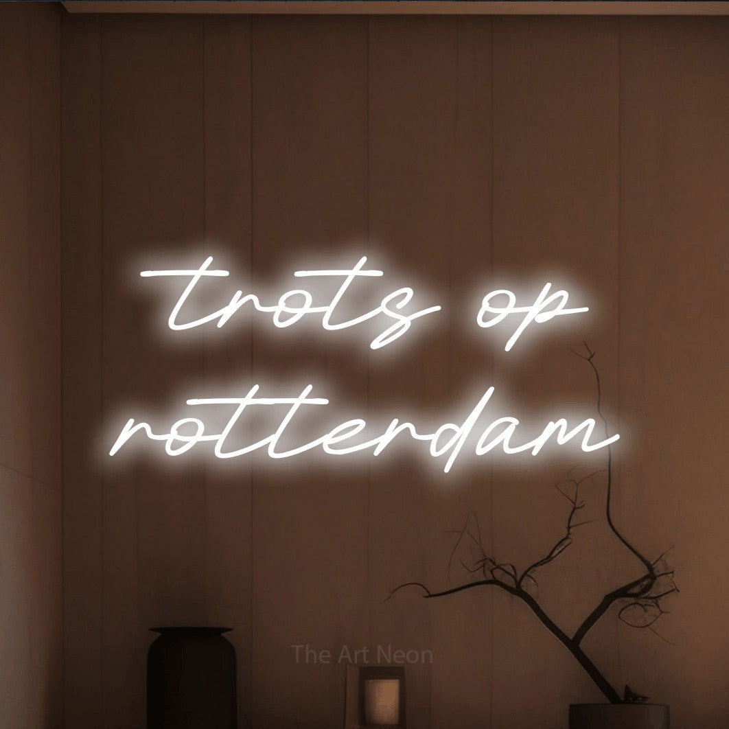 LED neon sign reading “trots op rotterdam”, arranged in 2 lines.