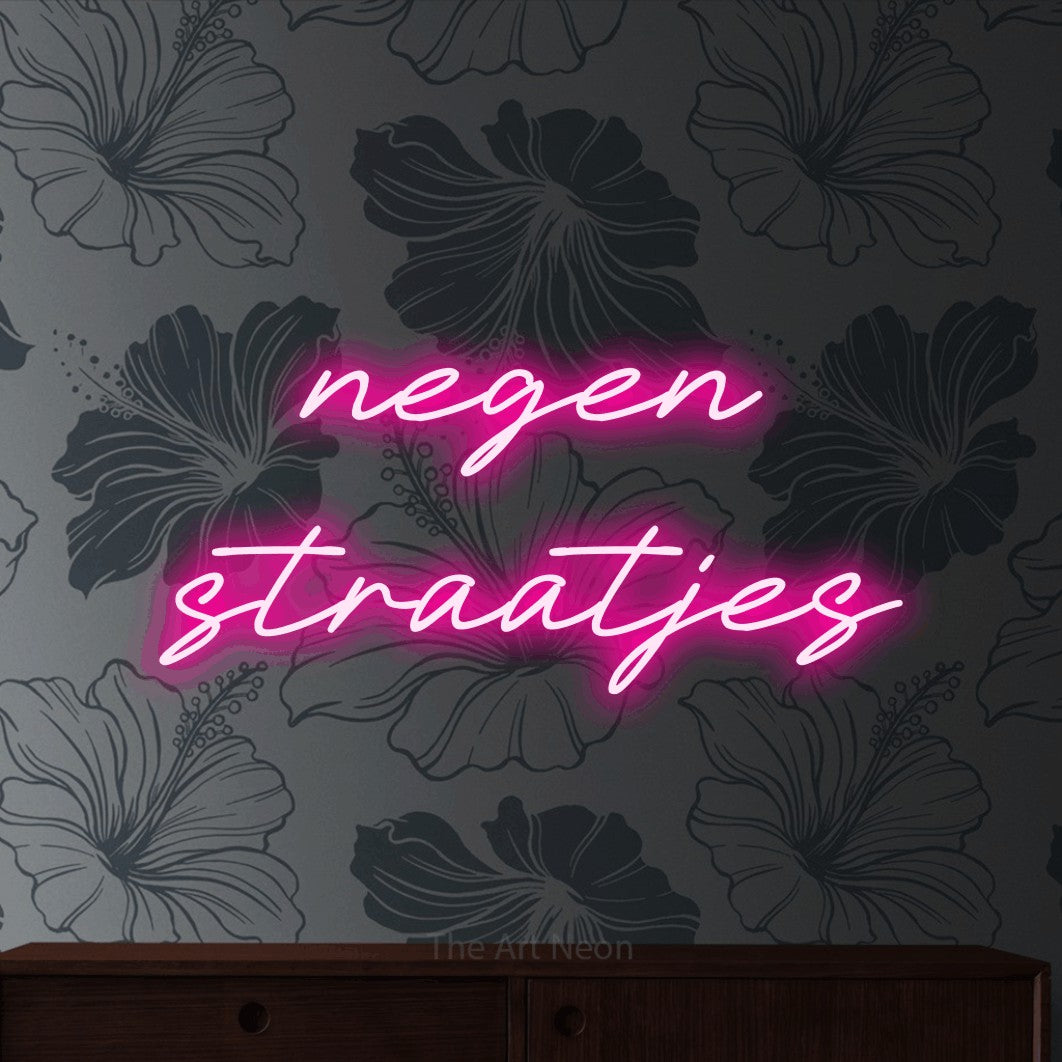 LED neon sign reading “negen straatjes”, arranged in 2 lines.
