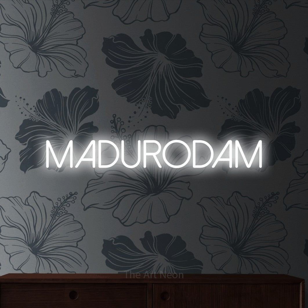 LED neon sign reading “madurodam”, arranged in a single line.