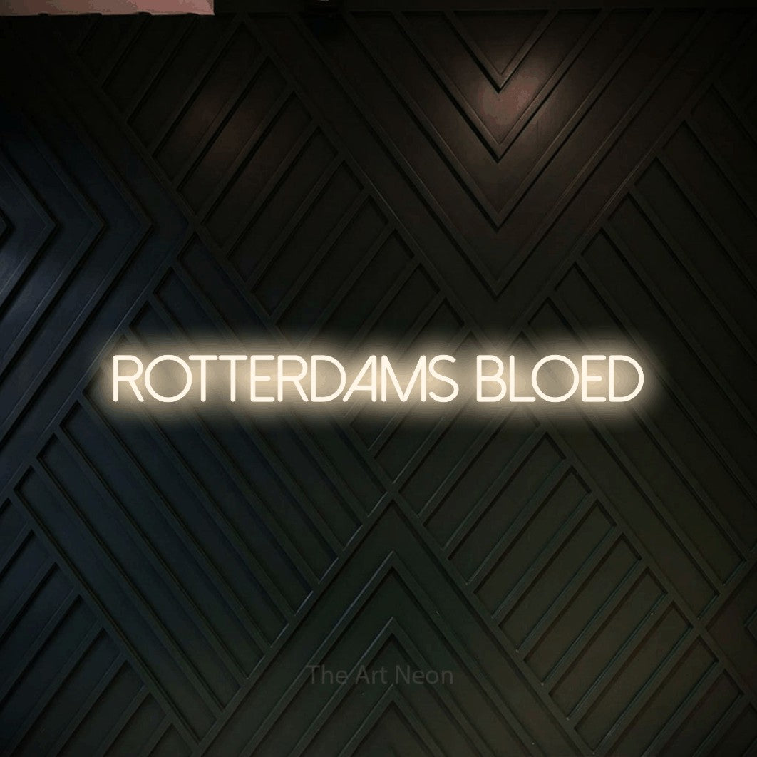 LED neon sign reading “rotterdams bloed”, arranged in a single line.
