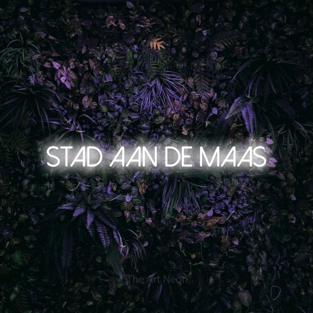 LED neon sign reading “STAD AAN DE MAAS”, arranged in a single line.