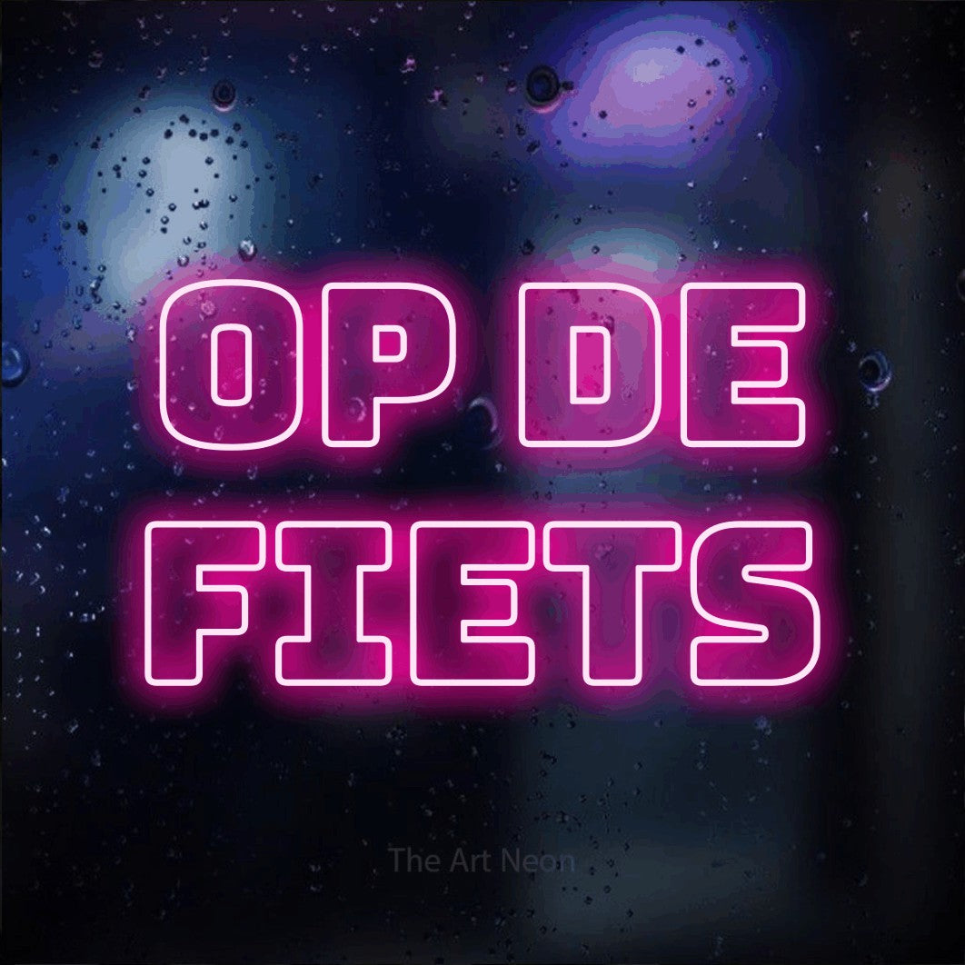 LED neon sign reading “op de fiets”, arranged in 2 lines.