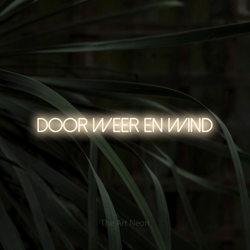 LED neon sign reading “DOOR weer en wind”, arranged in a single line.