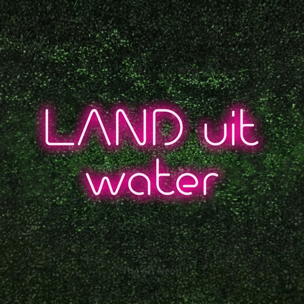 LED neon sign reading “LAND uit water”, arranged in 2 lines.