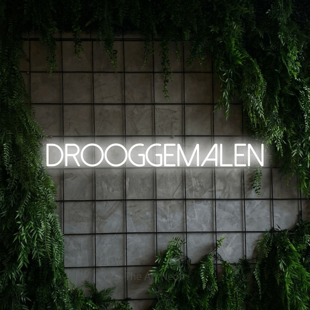 LED neon sign reading “drooggemalen”, arranged in a single line.