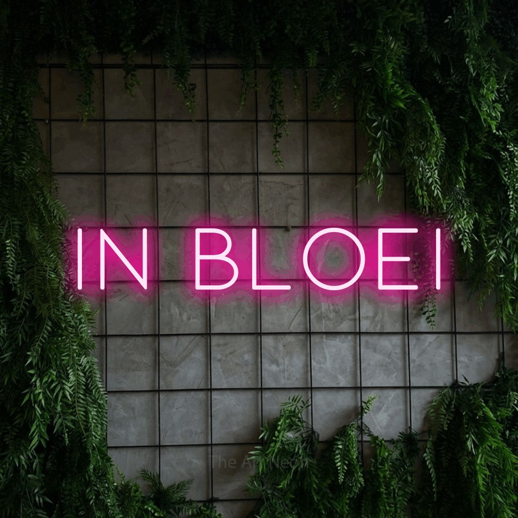 LED neon sign reading “In Bloei”, arranged in a single line.