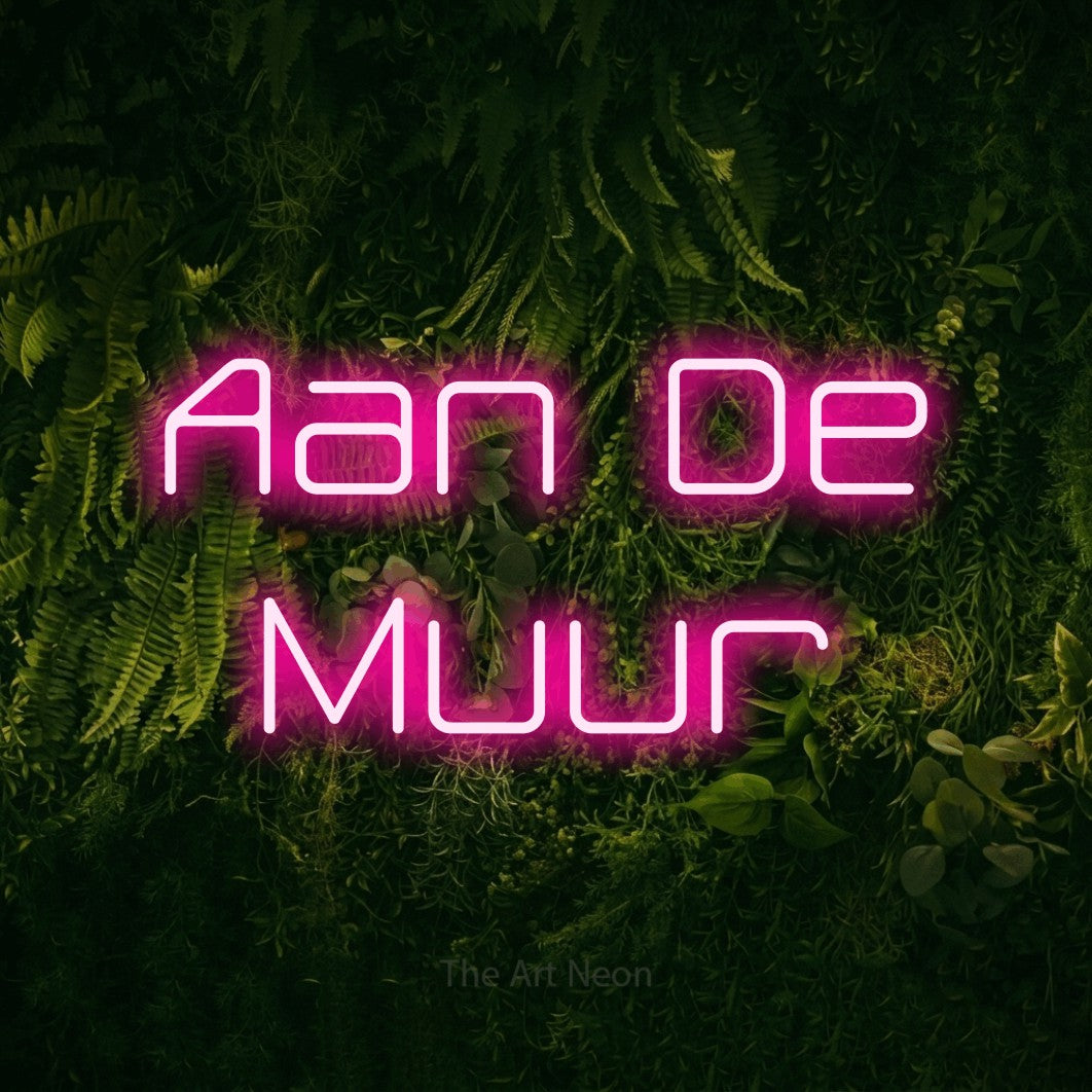 LED neon sign reading “Aan De Muur”, arranged in 2 lines.