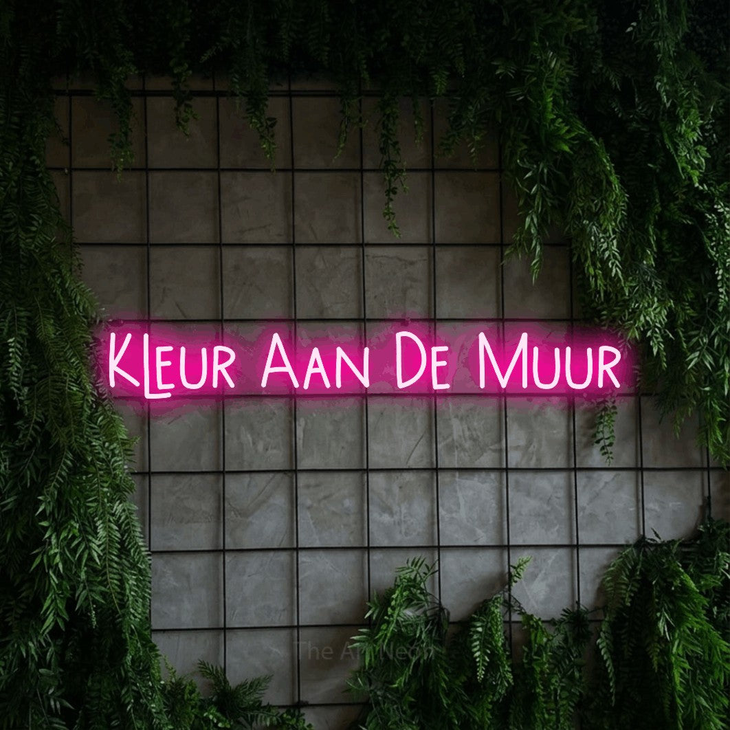 LED neon sign reading “Kleur Aan De Muur”, arranged in a single line.