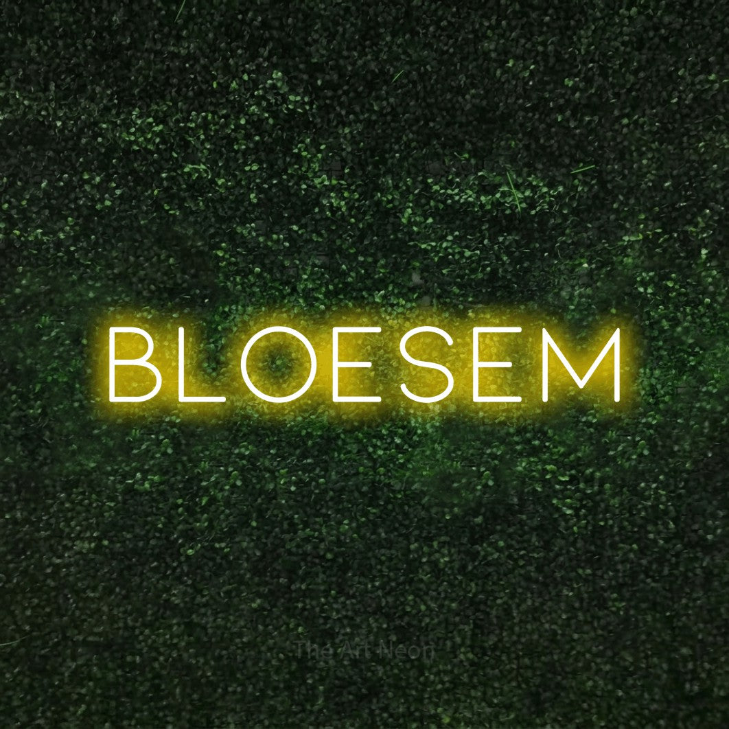 LED neon sign reading “BLOESEM”, arranged in a single line.