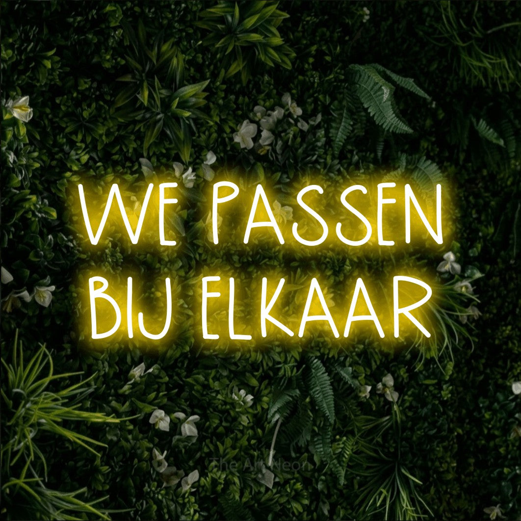 LED neon sign reading “WE PASSEN BIJ ELKAAR”, arranged in 2 lines.