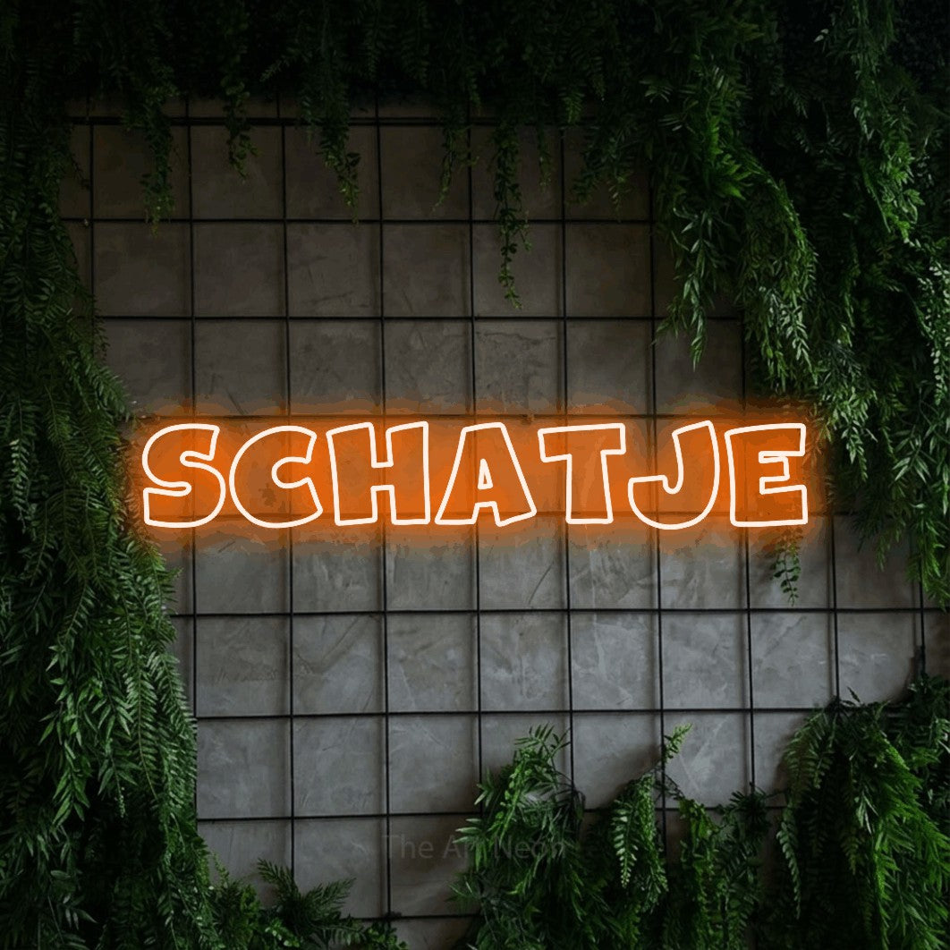 LED neon sign reading “schatje”, arranged in a single line.