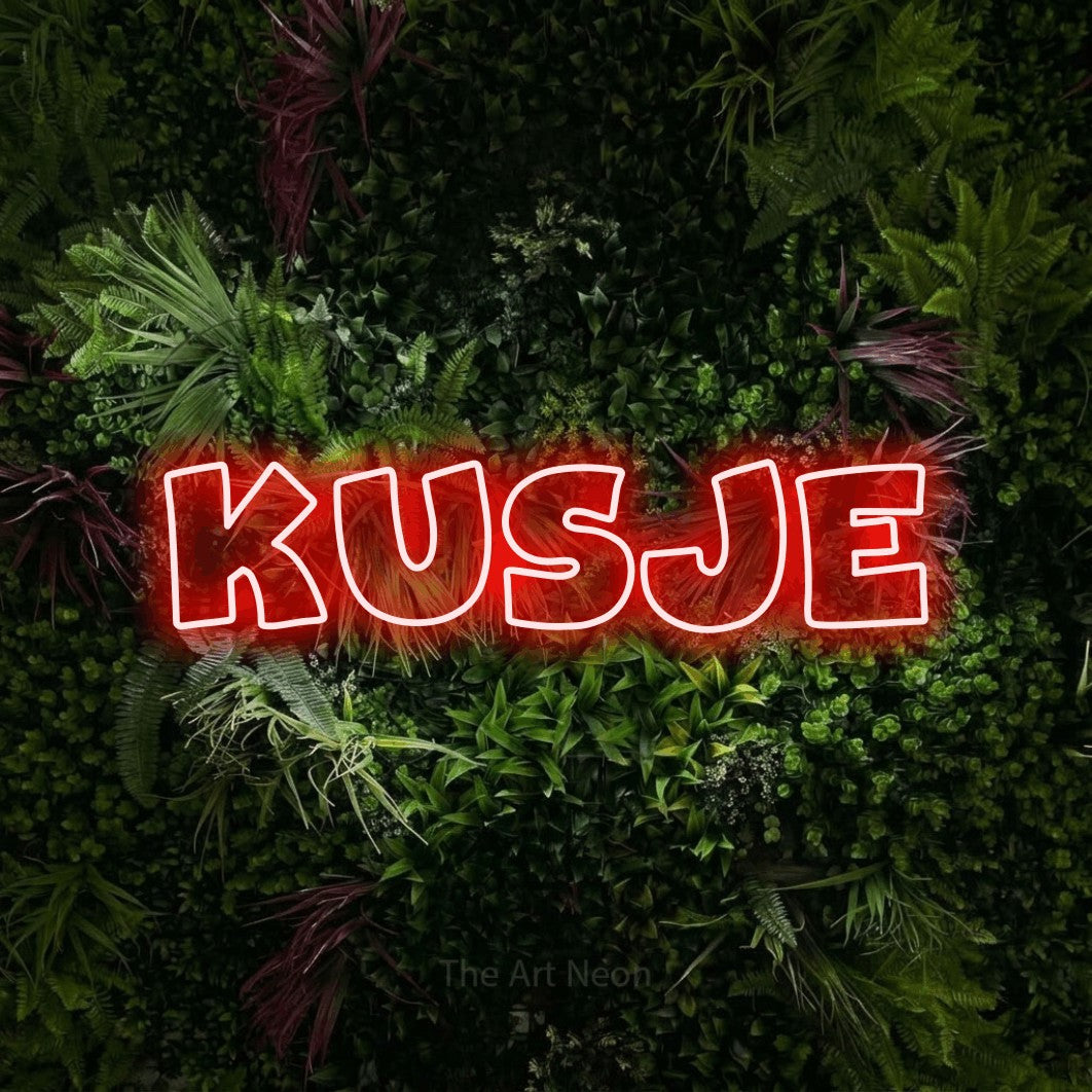LED neon sign reading “Kusje”, arranged in a single line.