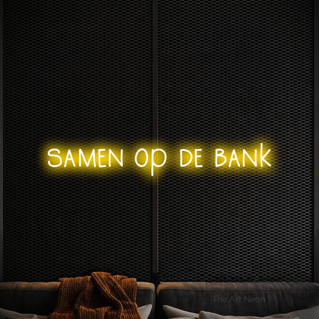 LED neon sign reading “samen op de bank”, arranged in a single line.
