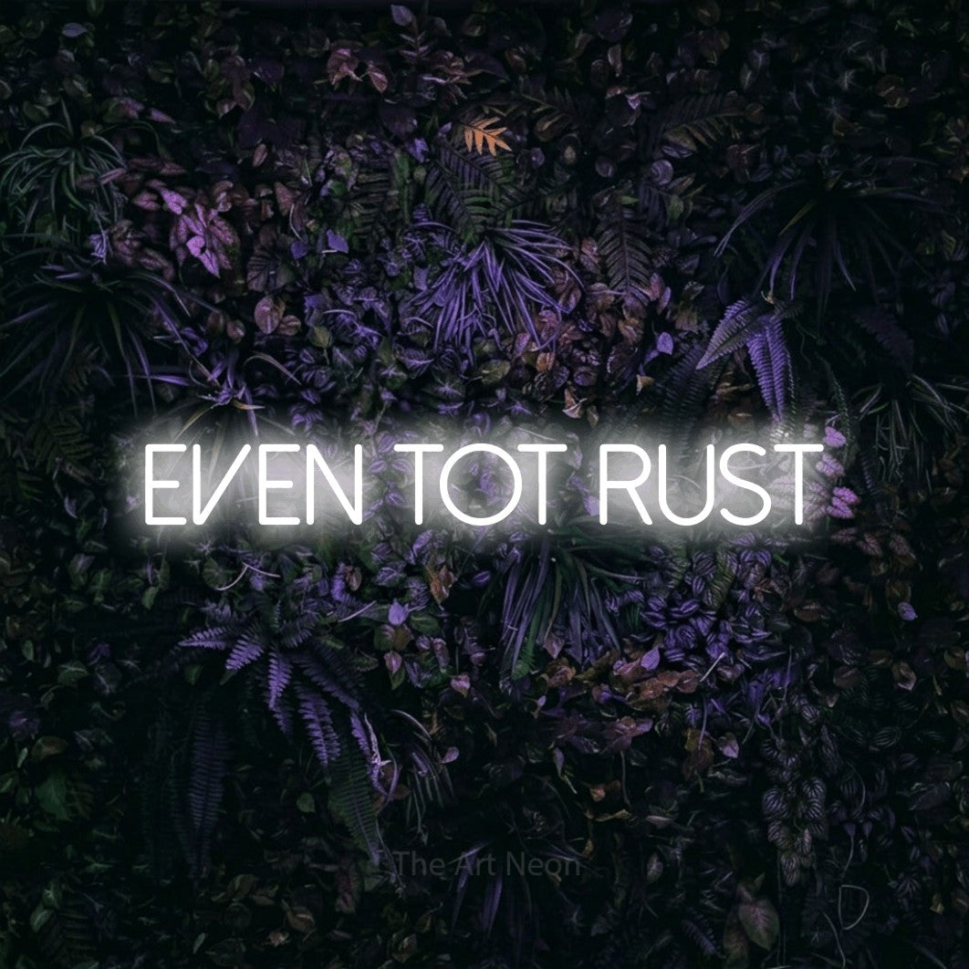 LED neon sign reading “even tot rust”, arranged in a single line.