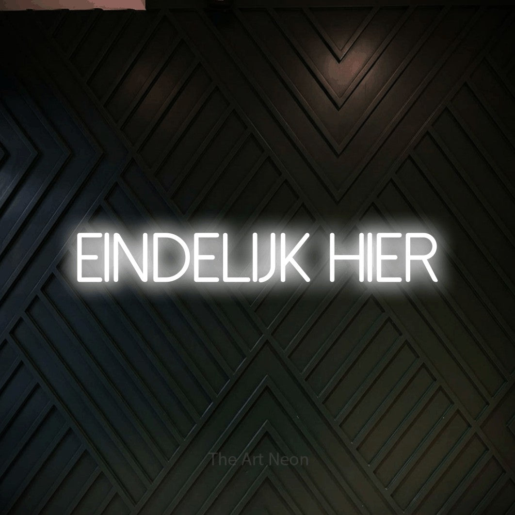 LED neon sign reading “EINDELIJK HIER”, arranged in a single line.