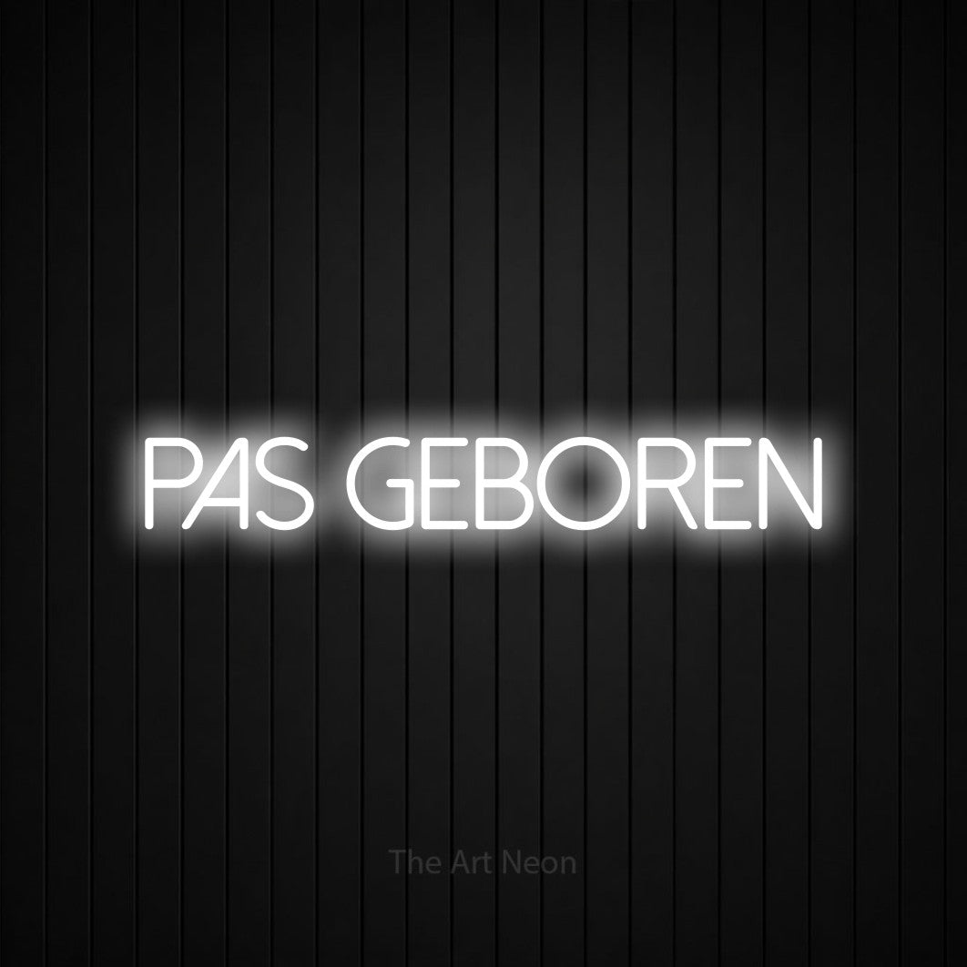 LED neon sign reading “pas geboren”, arranged in a single line.