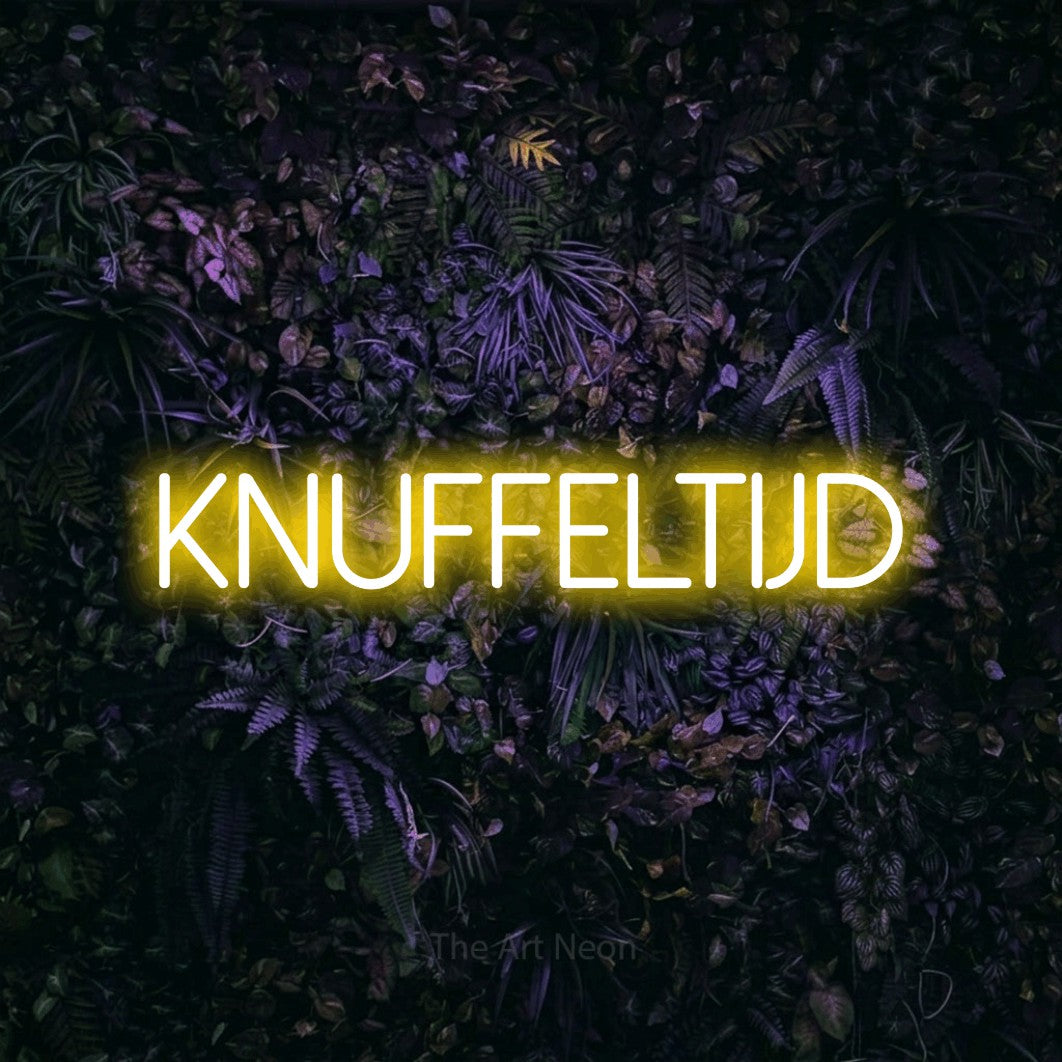 LED neon sign reading “KNUFFELTIJD”, arranged in a single line.