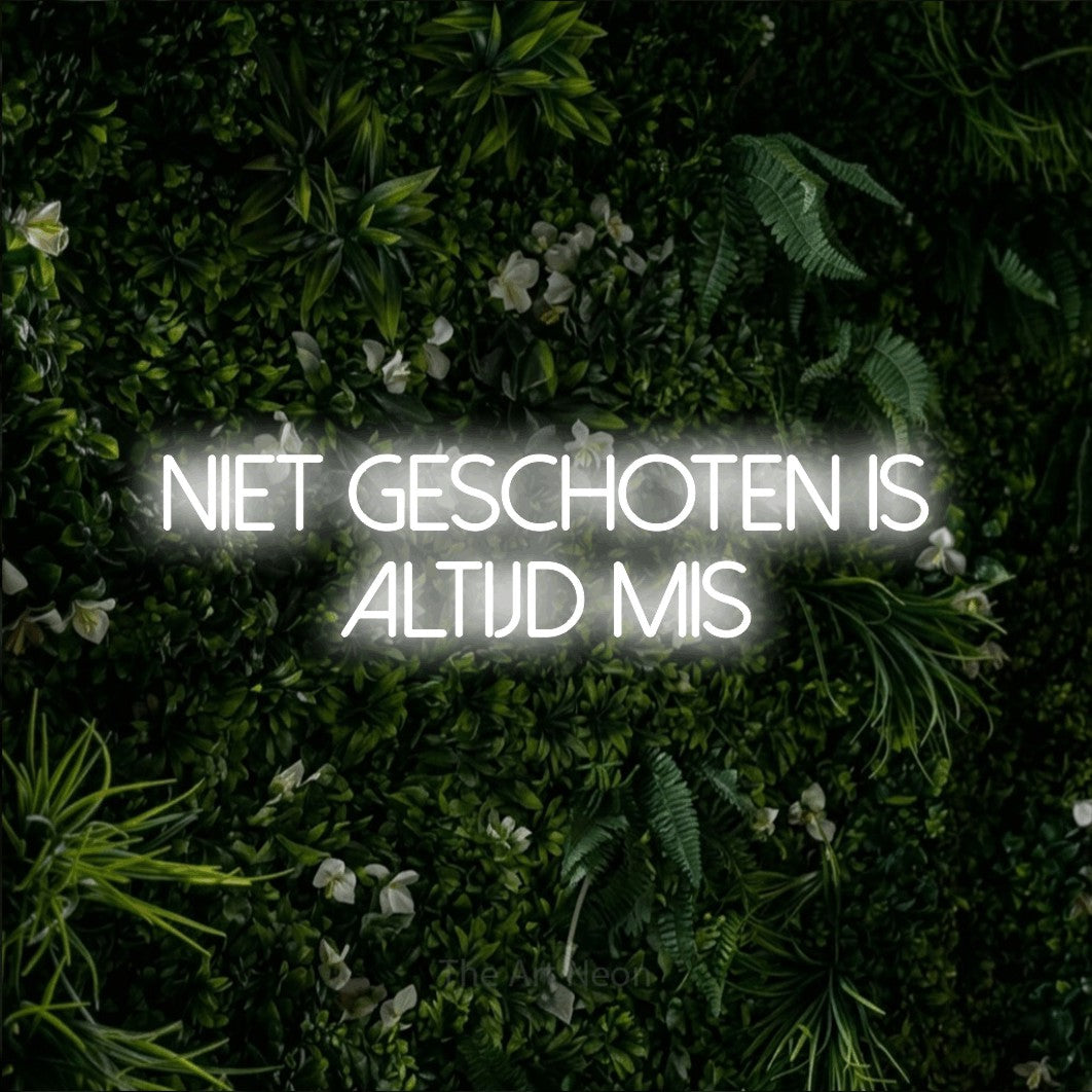 LED neon sign reading “NIET GESCHOTEN IS ALTIJD MIS”, arranged in 2 lines.
