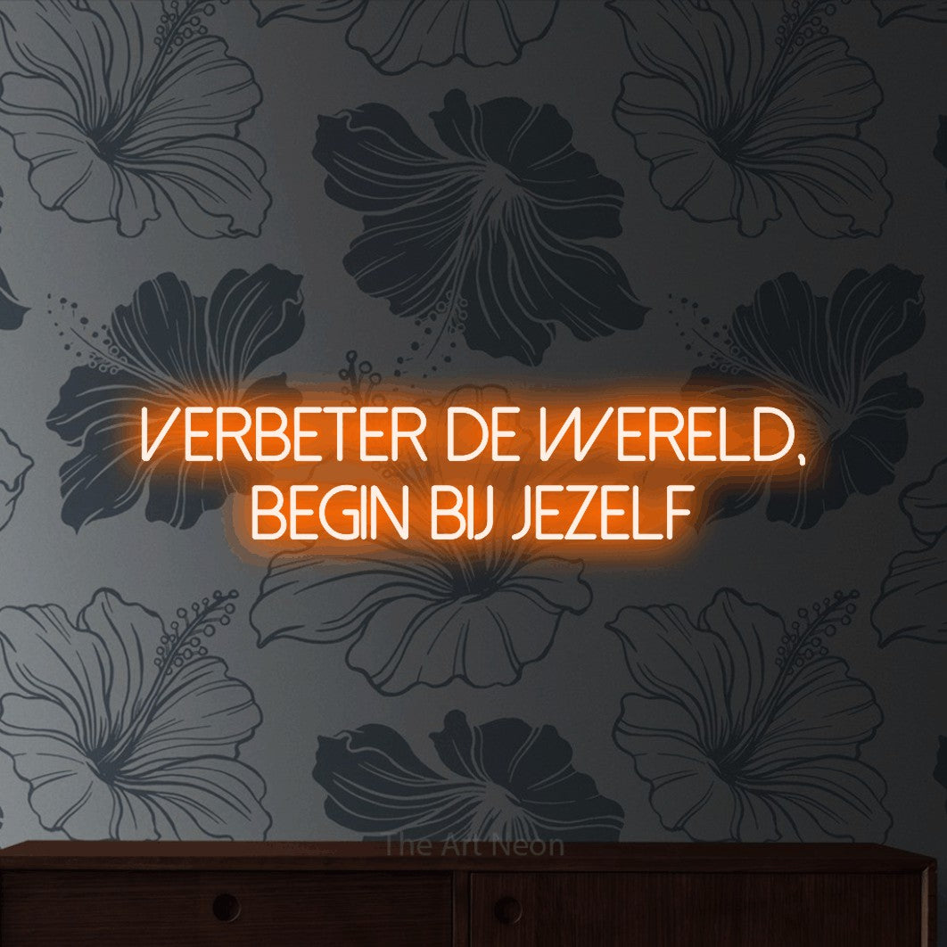 LED neon sign reading “Verbeter de wereld, begin bij jezelf”, arranged in 2 lines.
