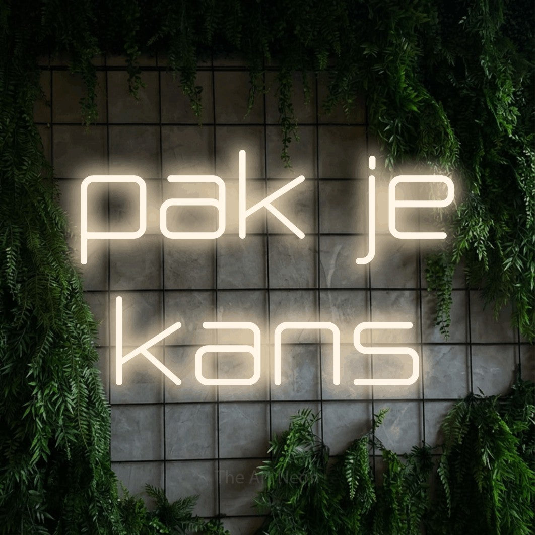 LED neon sign reading “pak je kans”, arranged in 2 lines.