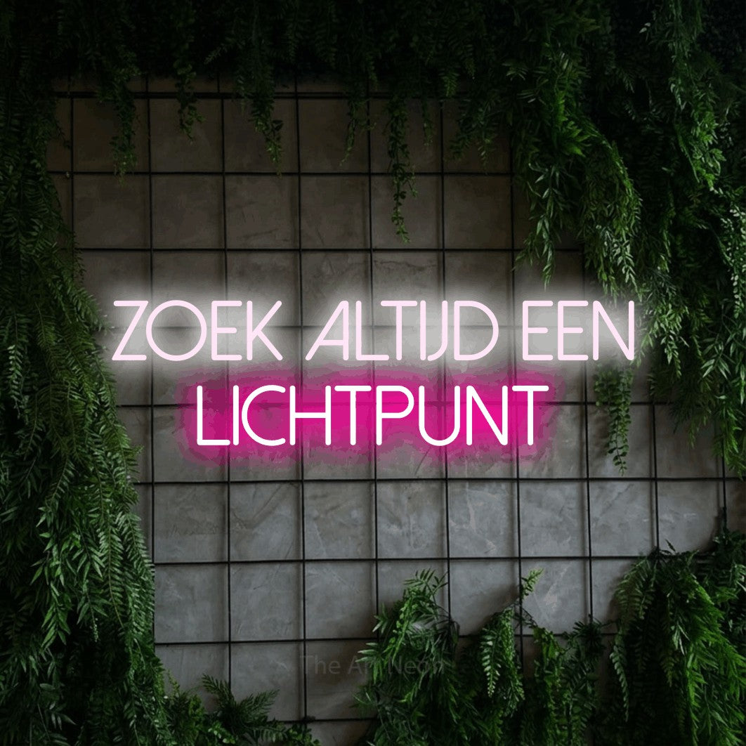 LED neon sign reading “ZOEK ALTIJD EEN LICHTPUNT”, arranged in 2 lines.