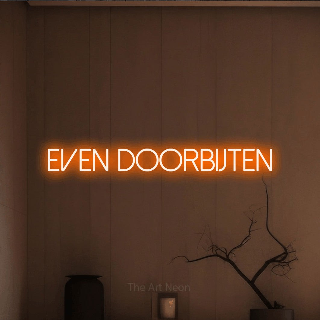 LED neon sign reading “Even Doorbijten”, arranged in a single line.