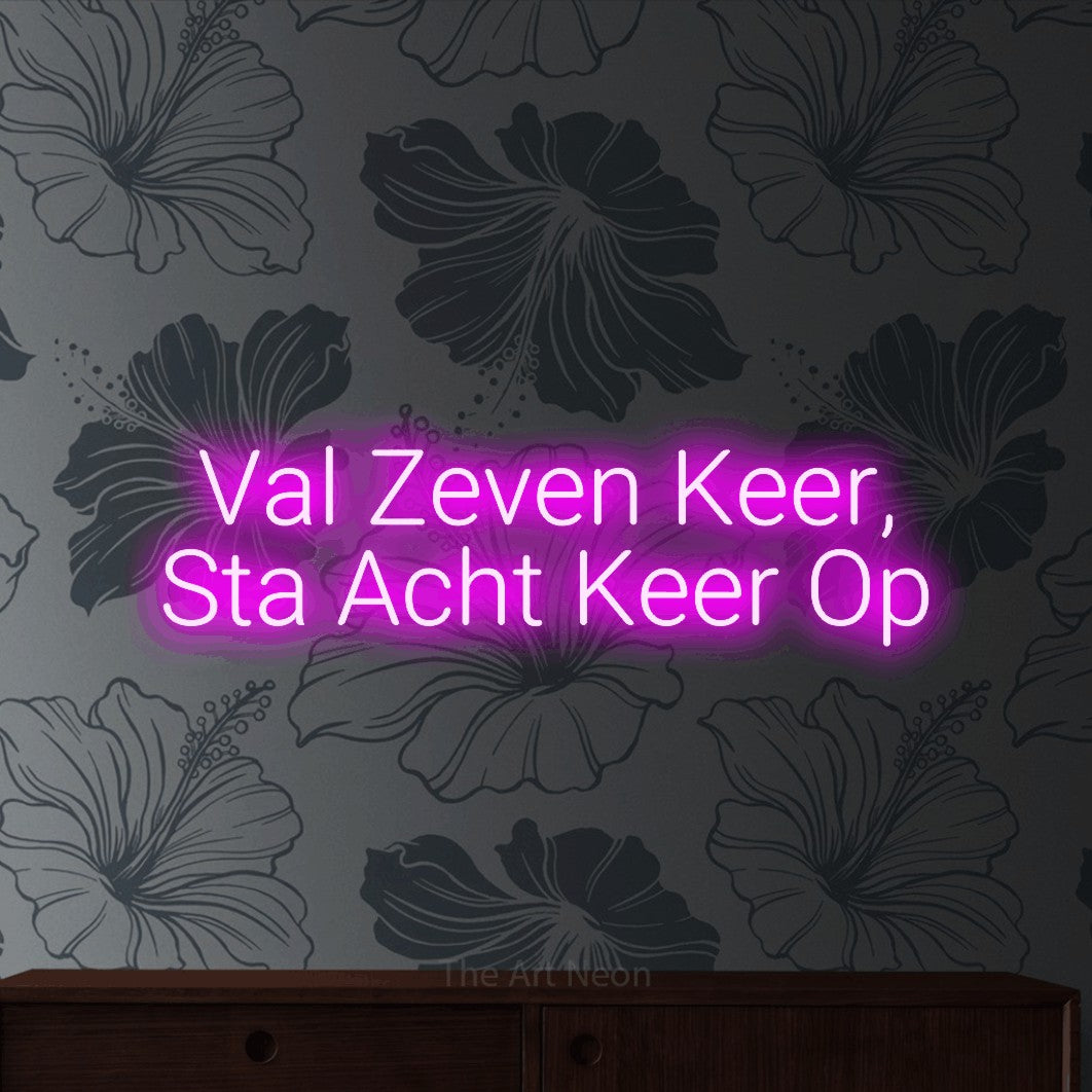 LED neon sign reading “Val Zeven Keer, Sta Acht Keer Op”, arranged in 2 lines.