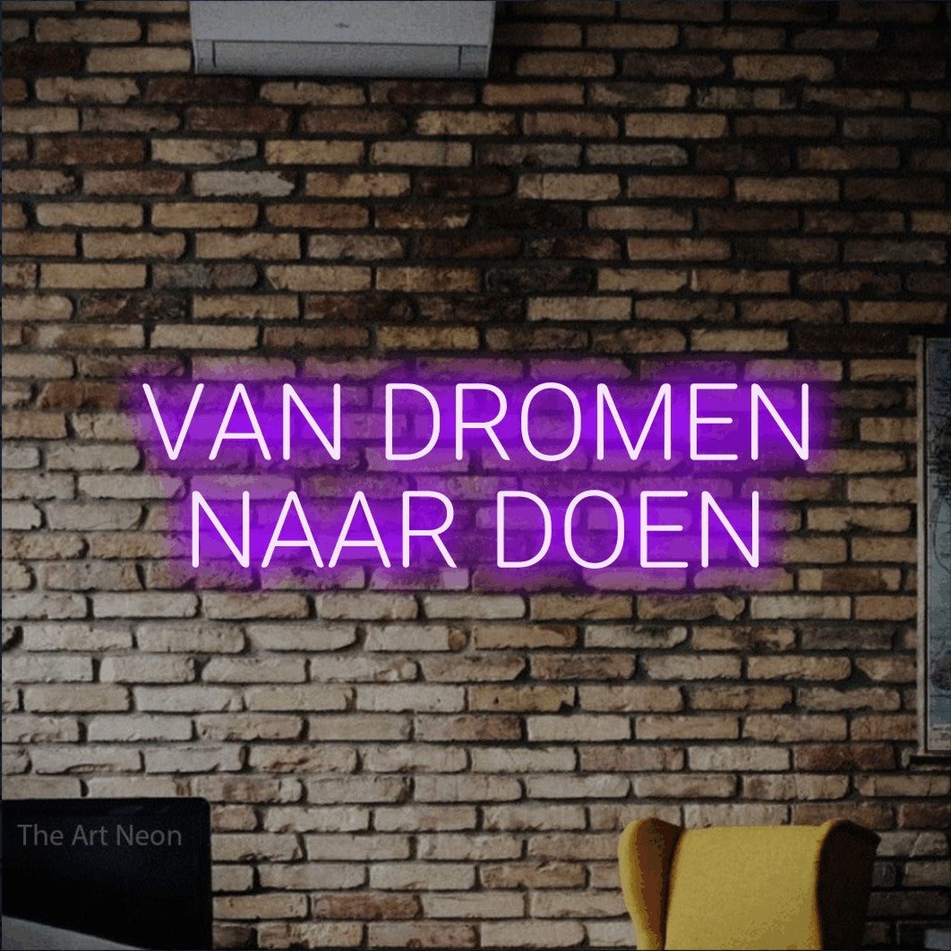 LED neon sign reading “VAN DROMEN NAAR DOEN”, arranged in 2 lines.