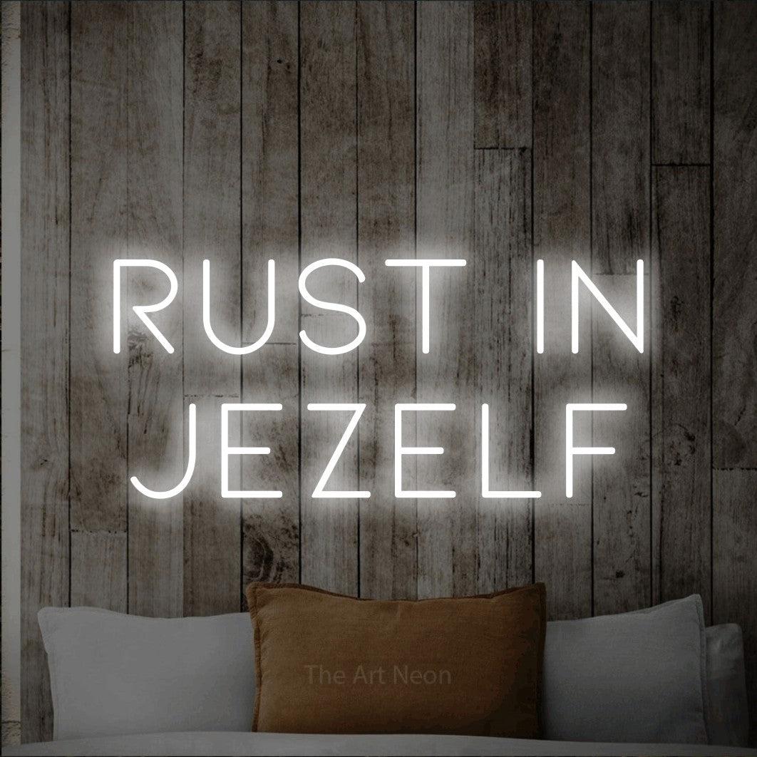 LED neon sign reading “RUST in jezelf”, arranged in 2 lines.