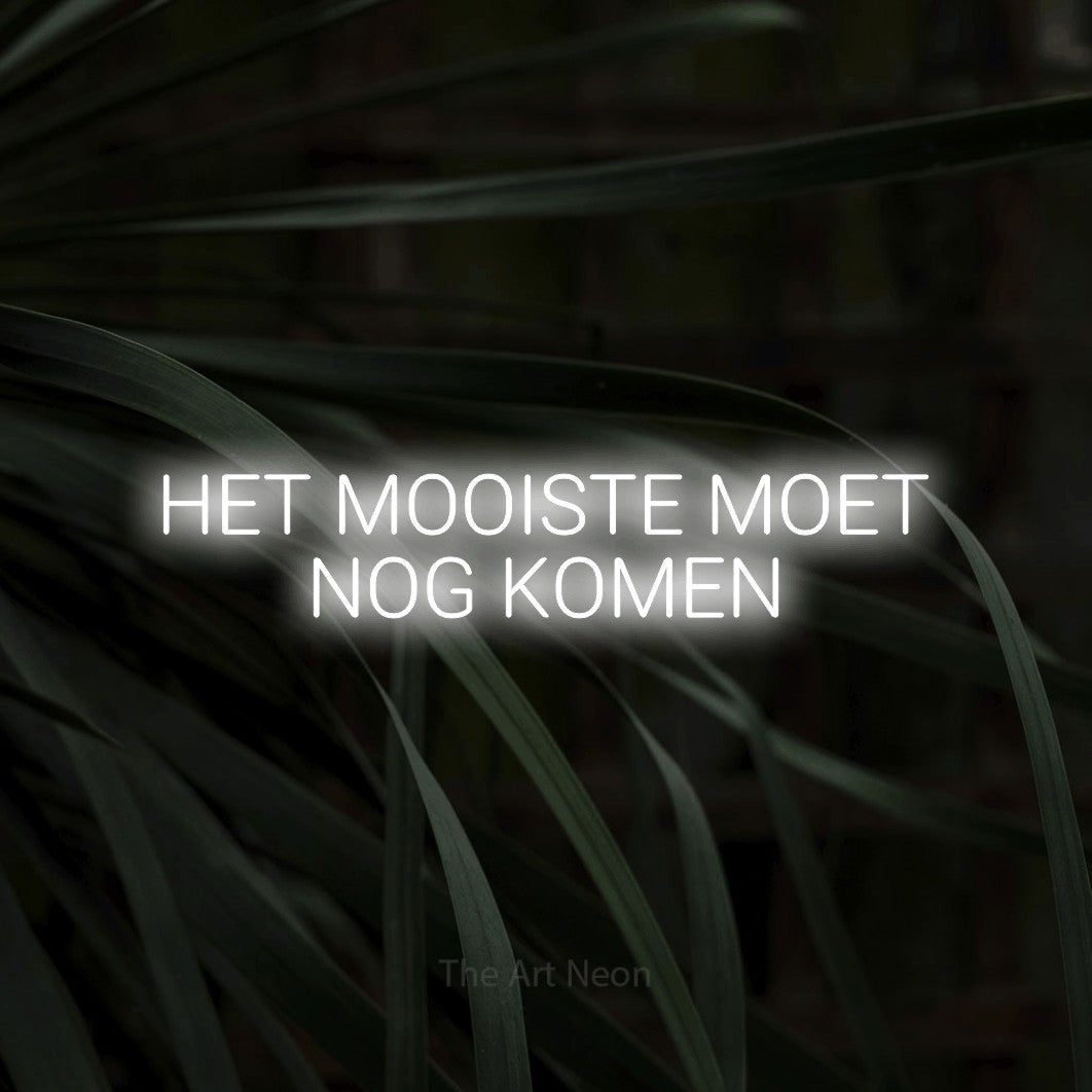 LED neon sign reading “HET MOOISTE MOET NOG KOMEN”, arranged in 2 lines.