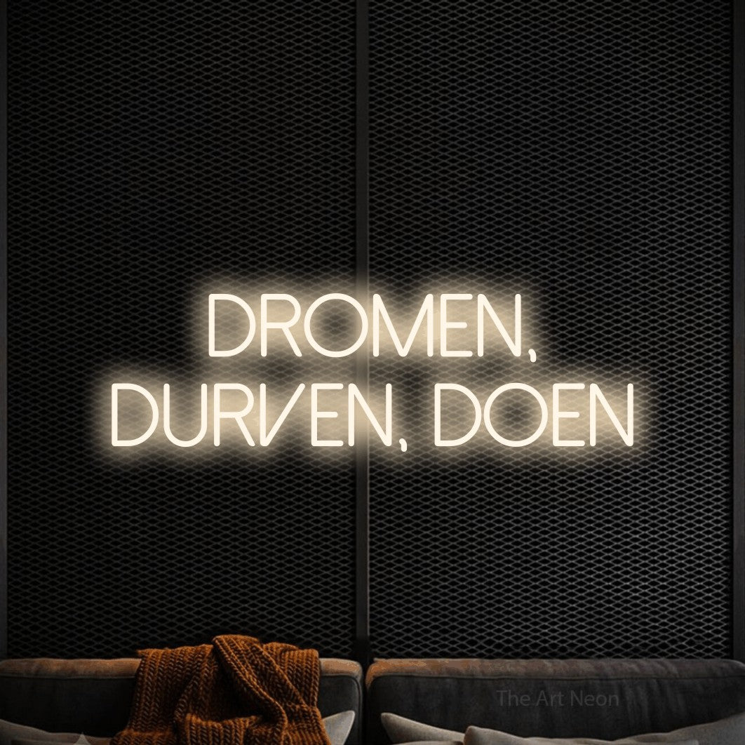 LED neon sign reading “Dromen, Durven, Doen”, arranged in 2 lines.
