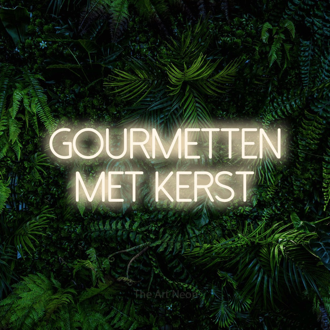 LED neon sign reading “Gourmetten Met Kerst”, arranged in 2 lines.