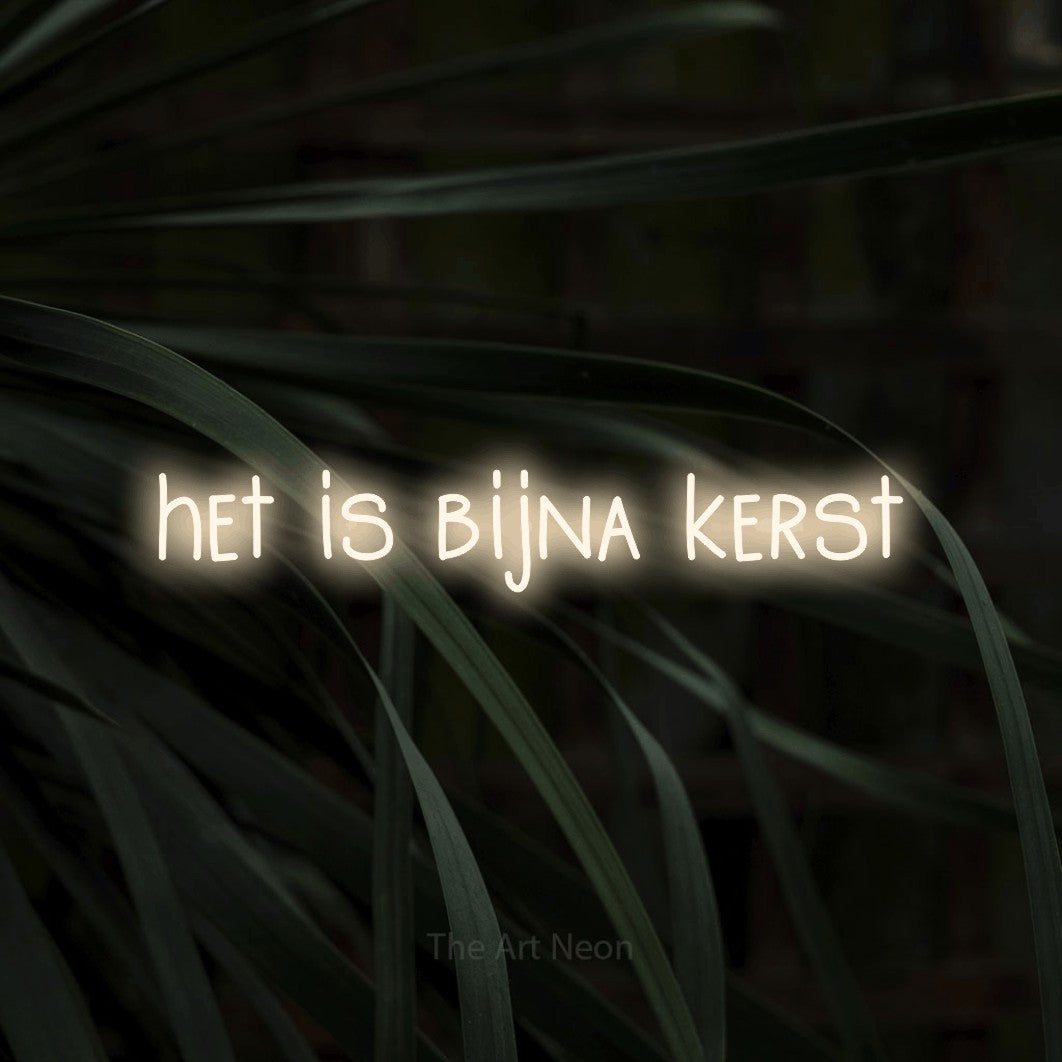 LED neon sign reading “het is bijna kerst”, arranged in a single line.