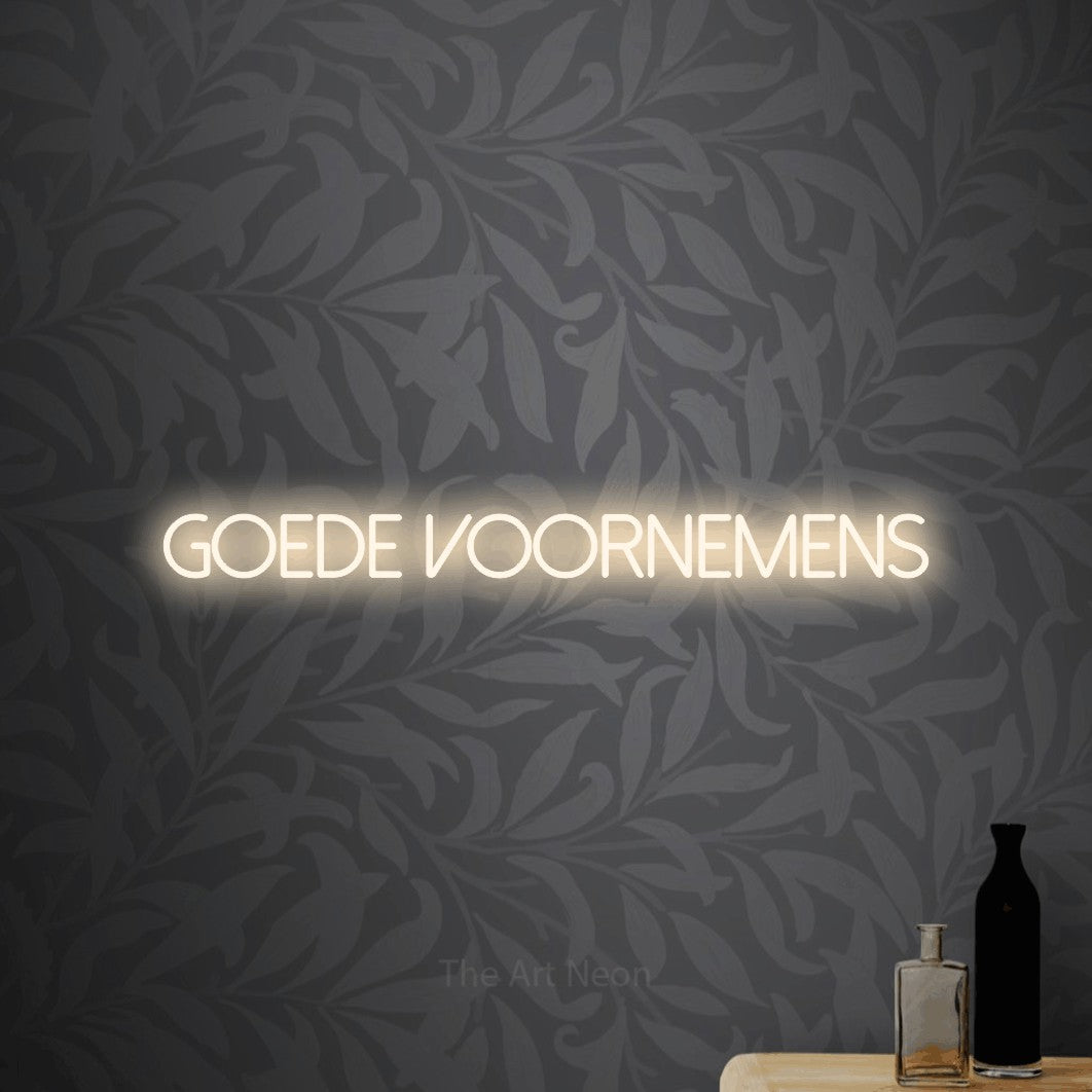 LED neon sign reading “goede voornemens”, arranged in a single line.