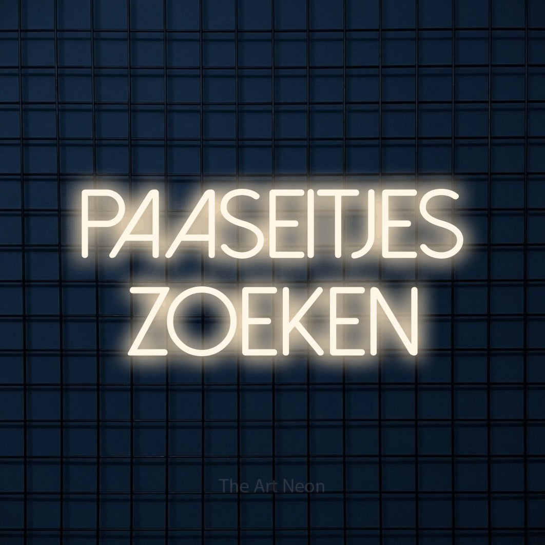 LED neon sign reading “PAASEITJES ZOEKEN”, arranged in 2 lines.